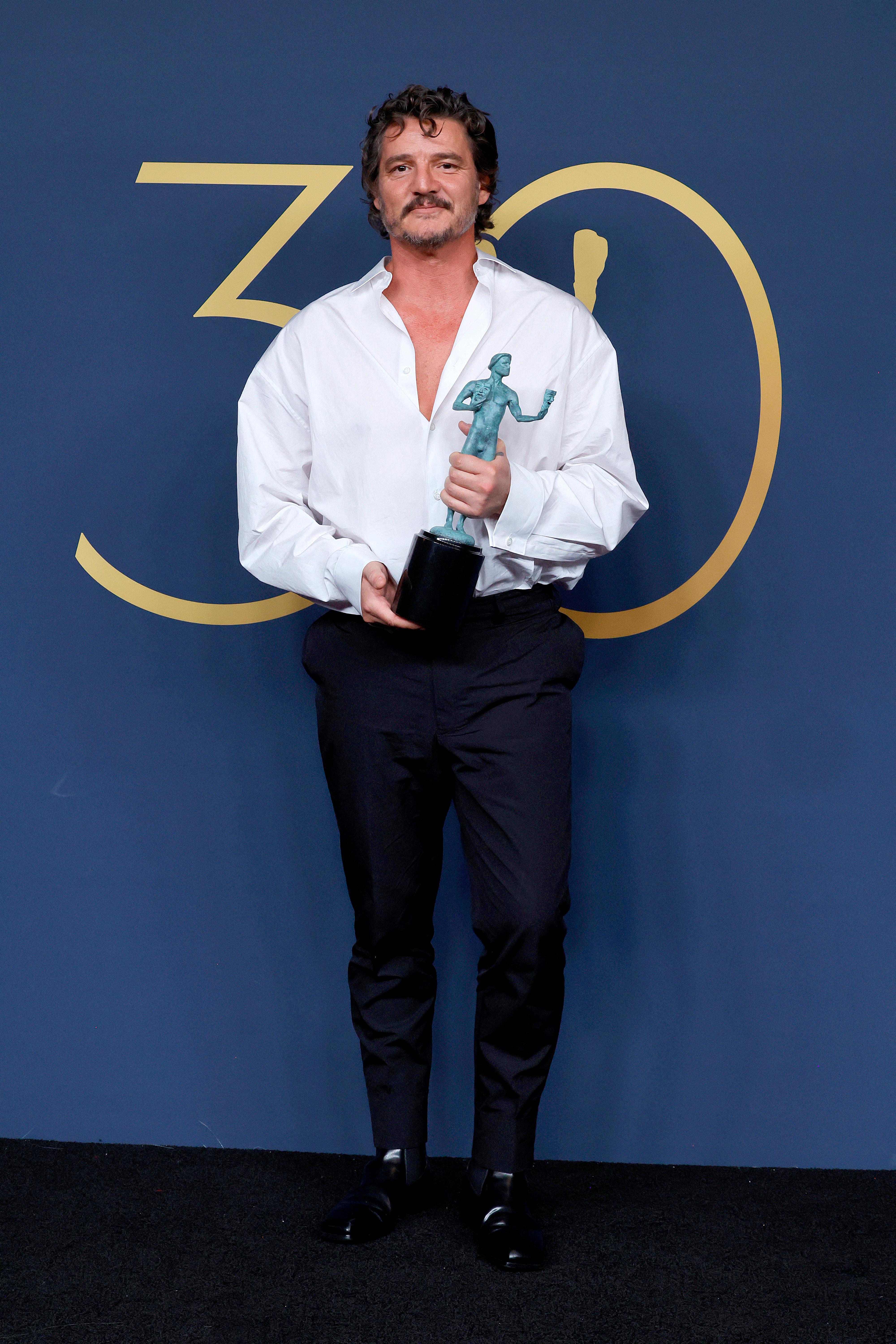 Pedro Pascal won the Outstanding Performance by a Male Actor in a Drama Series award for 'The Last of Us'. He posed for the press in the room during the 30th Annual Screen Actors Guild Awards