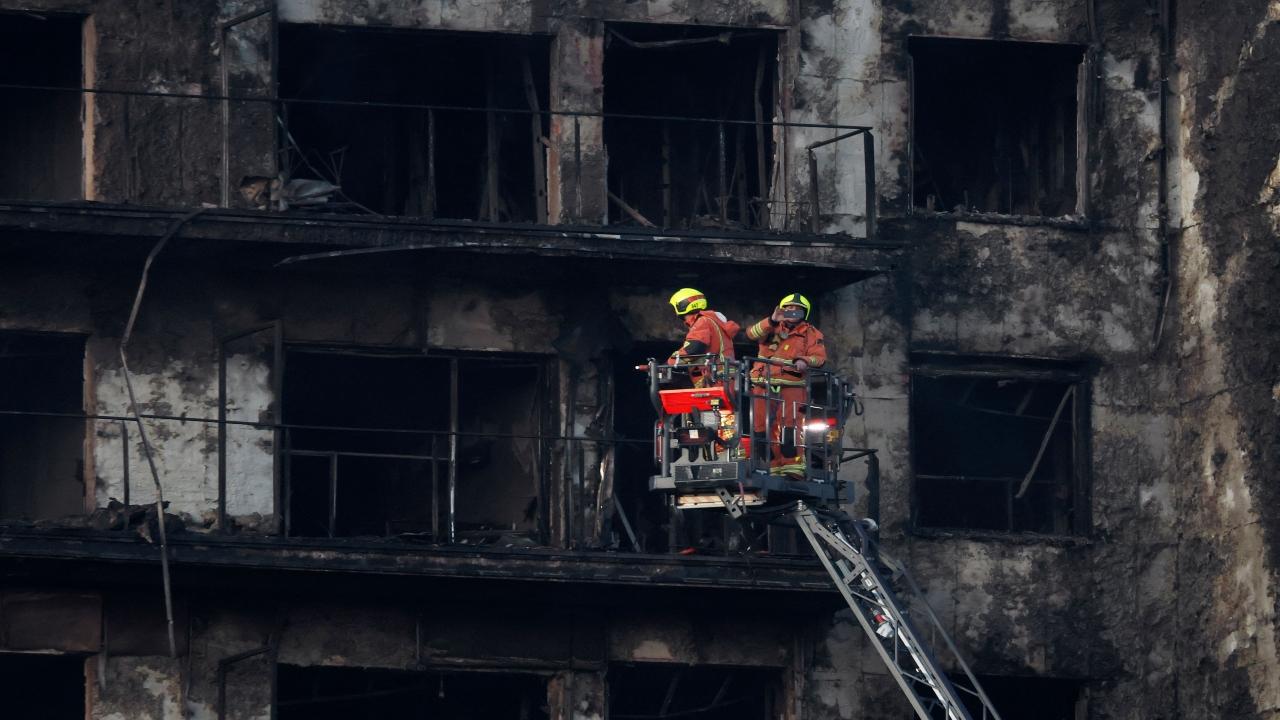 Firefighters and army experts on Friday were calculating the risks of entering a residential block that was destroyed by fire in the eastern Spanish city of Valencia, killing four people and leaving 14 missing