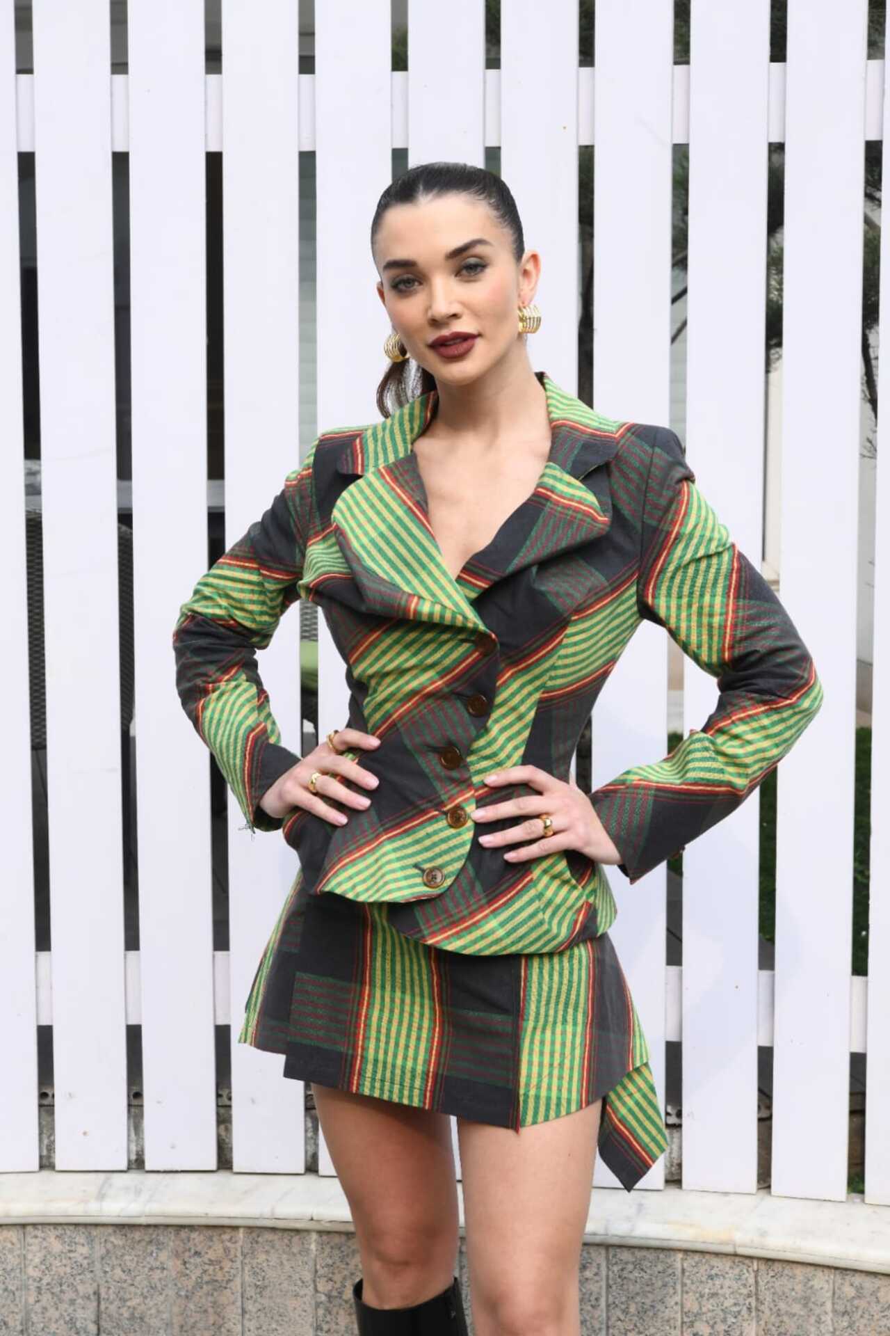 Newly engaged Amy Jackson looked stunning in a green checkered dress while promoting her upcoming film 'Crakk' in Mumbai