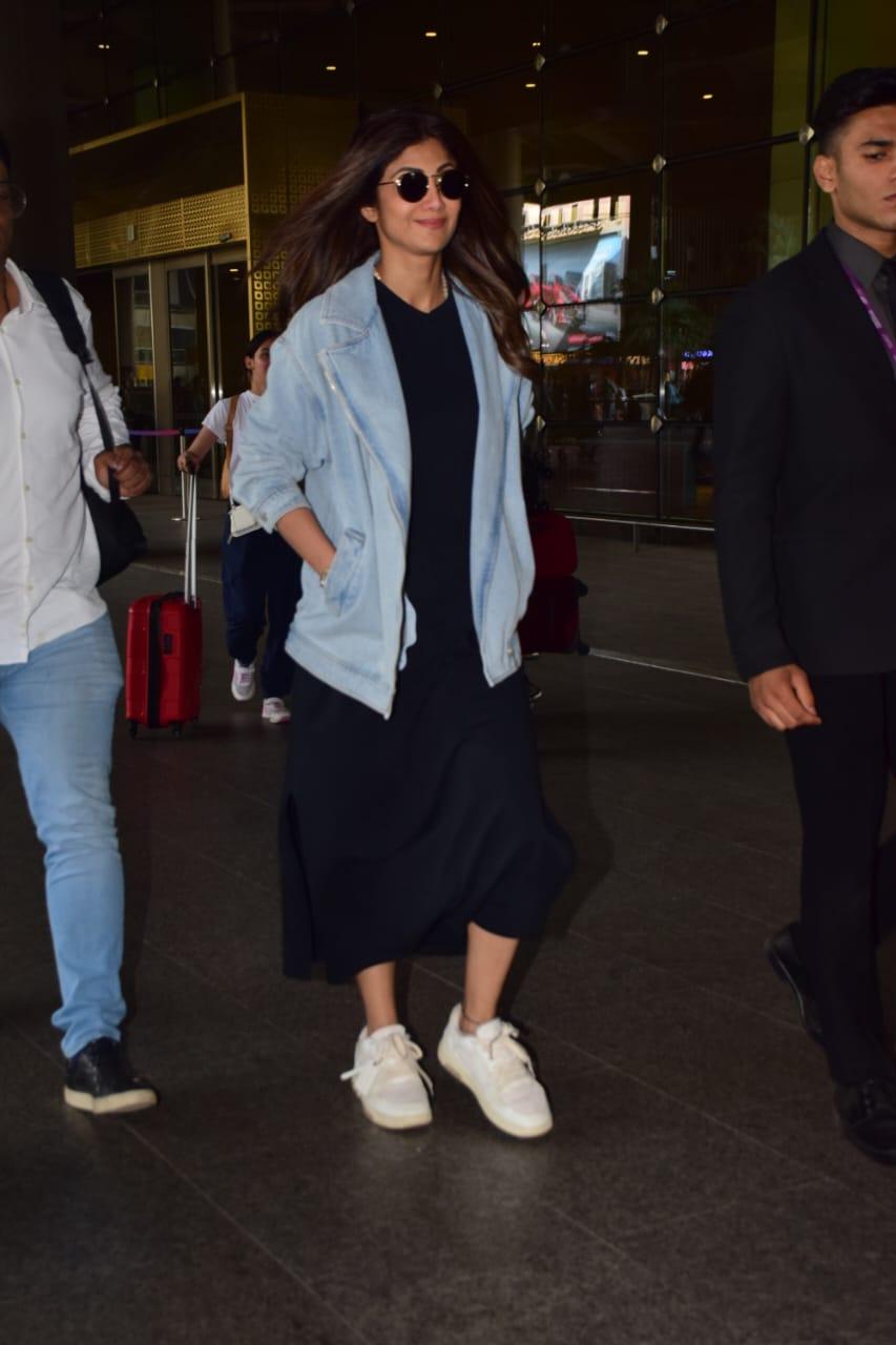 Shilpa Shetty aced her airport look by wearing a black dress and pairing it with a denim jacket