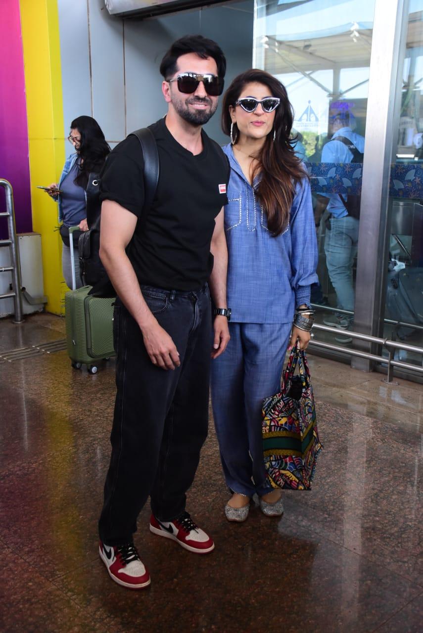 Ayushmann Khurrana and Tahira Kashyap kept it casual and comfy, with Ayushmann in a black t-shirt and denim, and Tahira in a blue casual outfit paired with white jutti