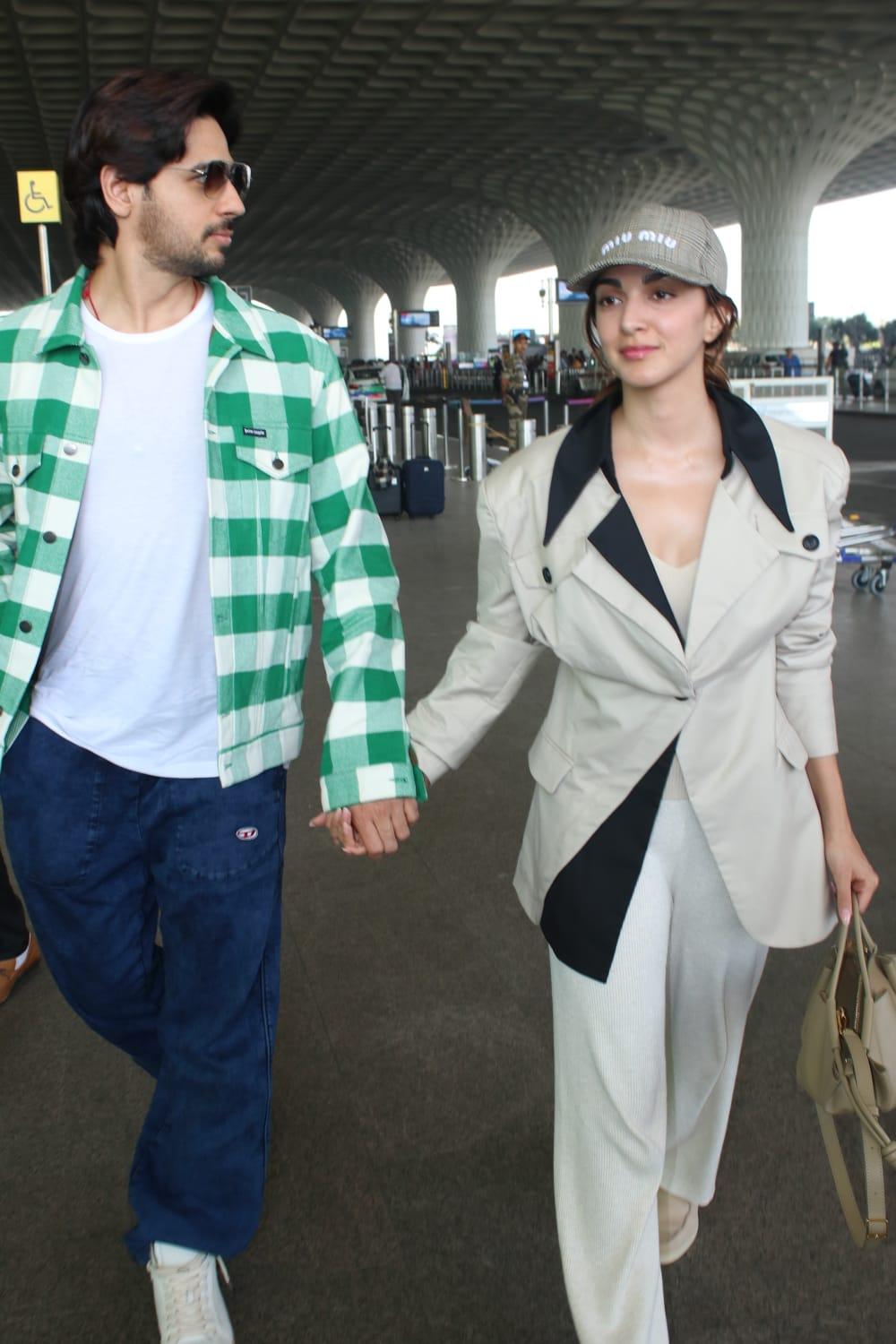 The lovebirds looked stylish as ever as they walked in the airport hand-in-hand exuding love