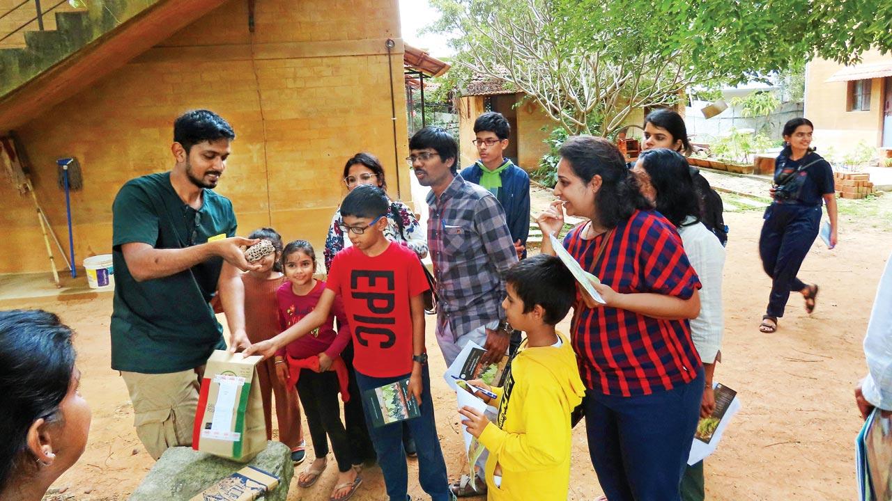 Yuvan Aves talking to children and parents during an insect walk