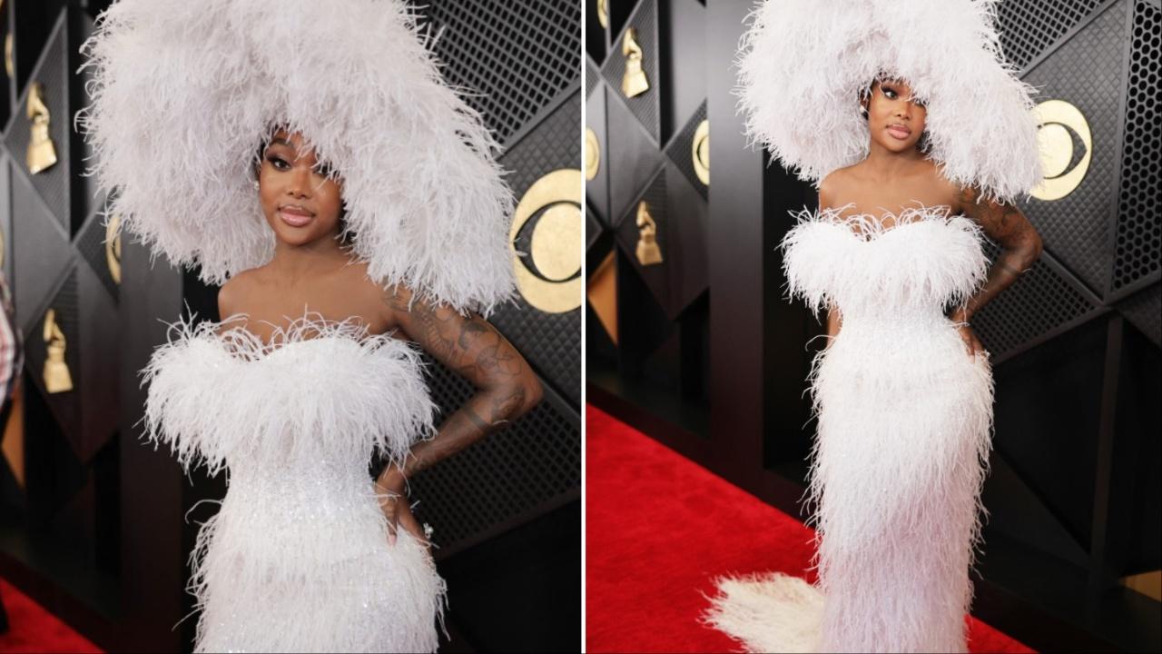 Singer Summer Walker, nominated for her R&B album 'Clear 2: Soft Life,' walked the red carpet wearing a feathery white gown and oversized hat.