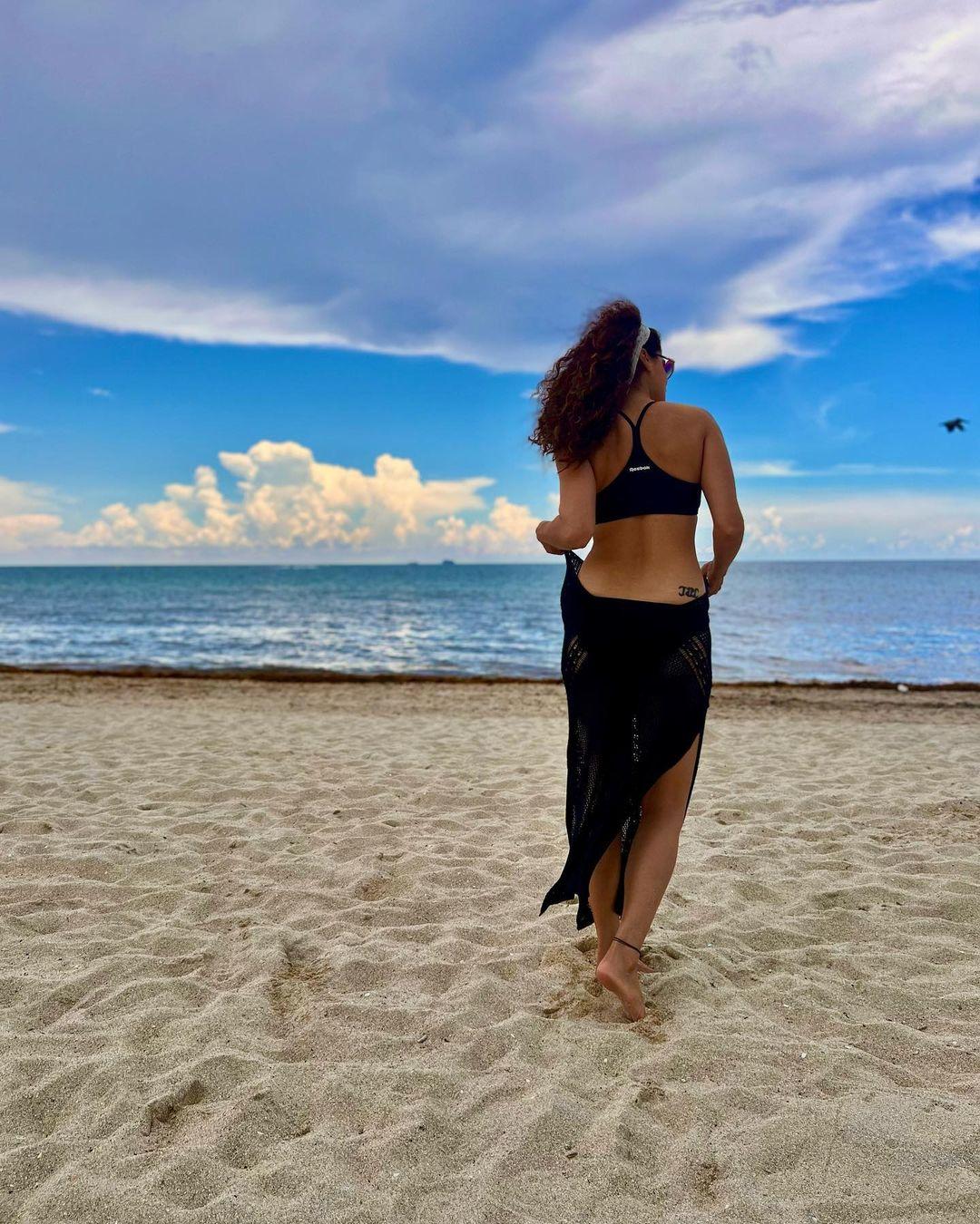 This is a summer fashion inspiration gallery, so a beach picture is a must! Taapsee likes to wear comfortable tops along with sarongs that allow her to feel comfortable and have fun at the beach