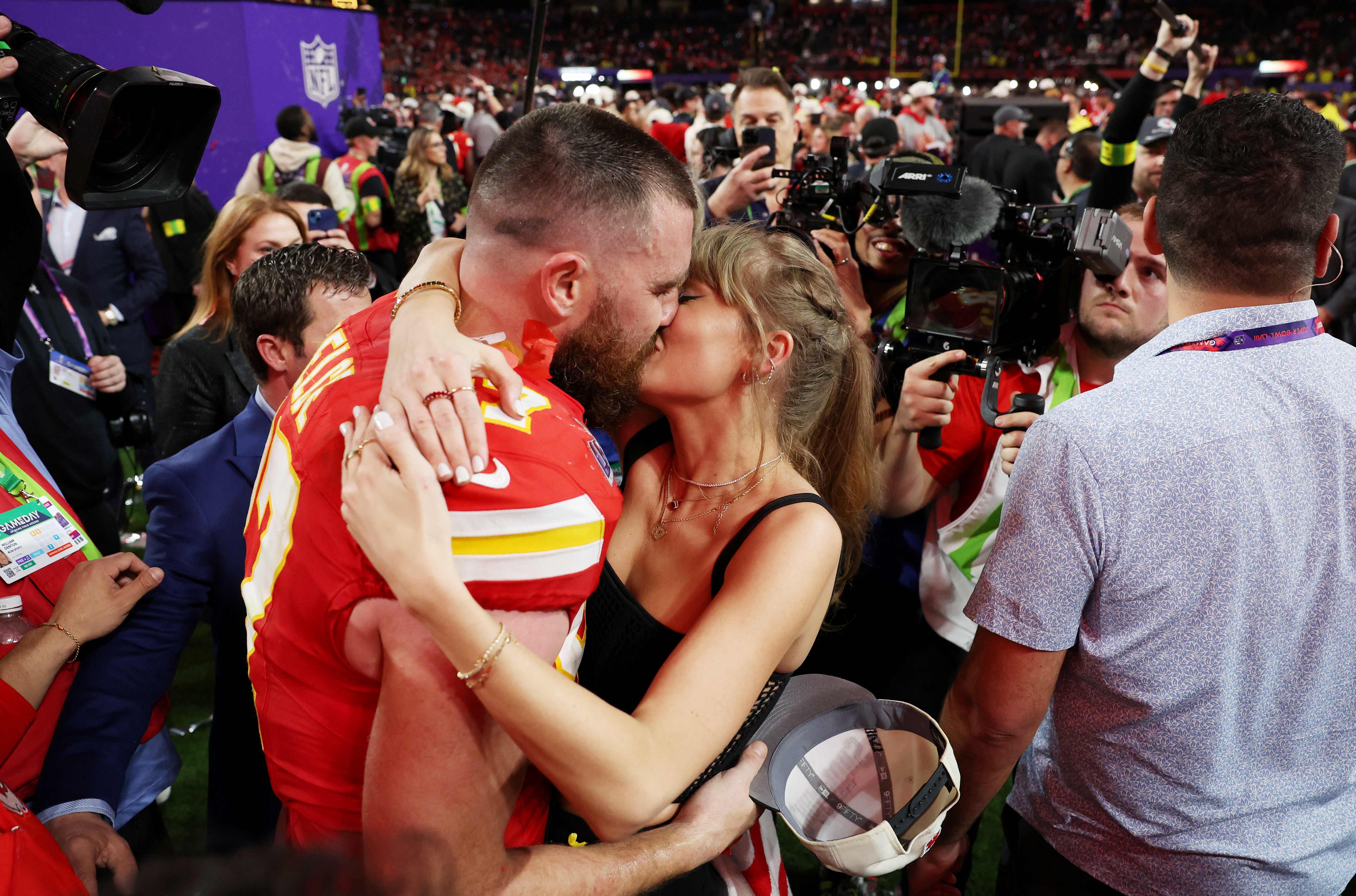 Swift and Kelce were seen sharing a passionate kiss after the Chiefs' win at the Super Bowl 2024. (Photo: AFP)
