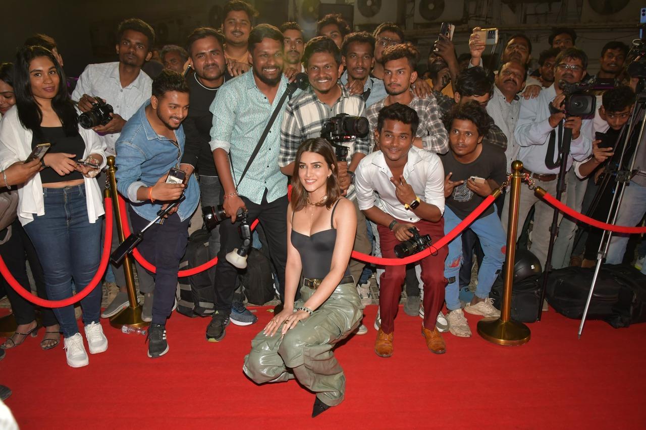 Kriti Sanon poses with the paparazzi who covered the red carpet of the film screening