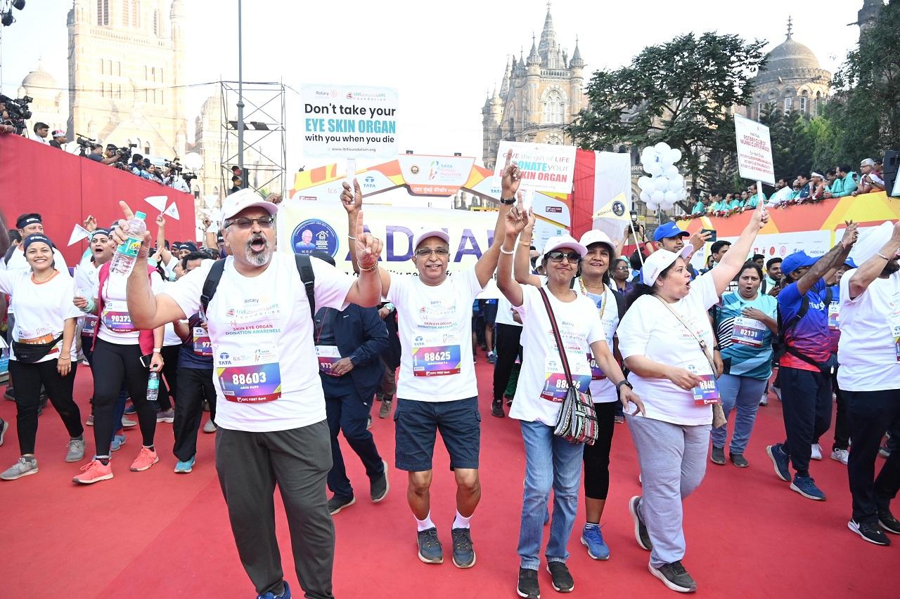 The participation breakdown includes 10,711 runners in the Marathon, 15,218 in the Half Marathon, 7,130 in the Open 10K, 20,590 in the Dream Run, 1,782 in the Senior Citizens Run, and 1,114 in the Champions with Disability category