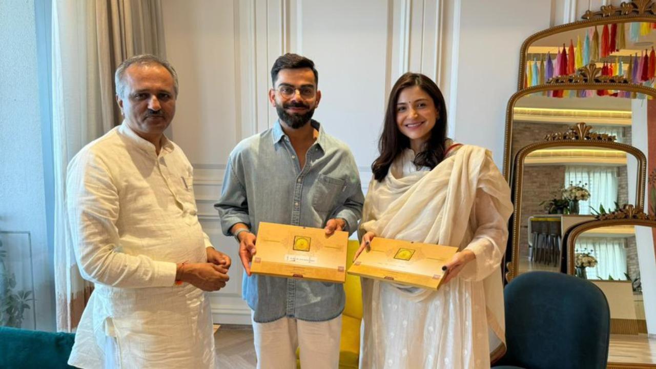 A fan page dedicated to the cricketer shared a picture of Anushka Sharma and Virat Kohli posing with the invitation card for Ram Mandir consecration ceremony. Read More
