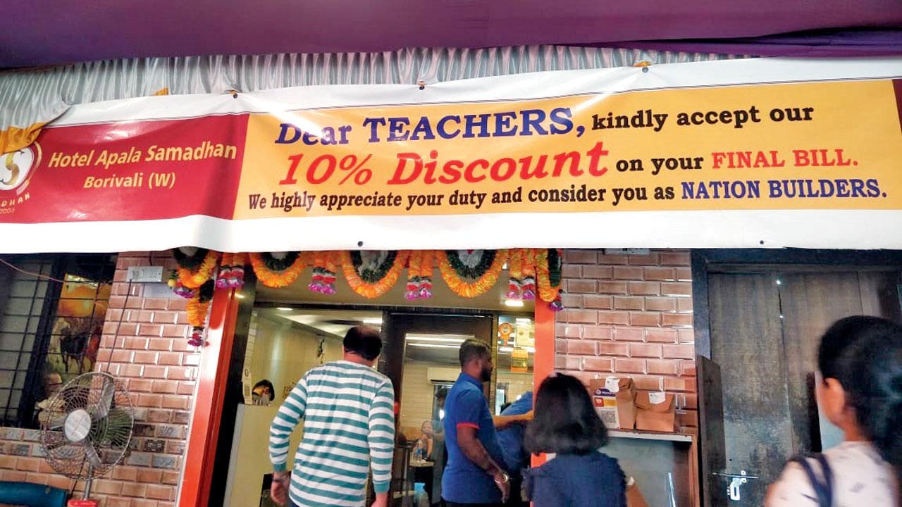 The poster above the eatery announcing discounts for teachers