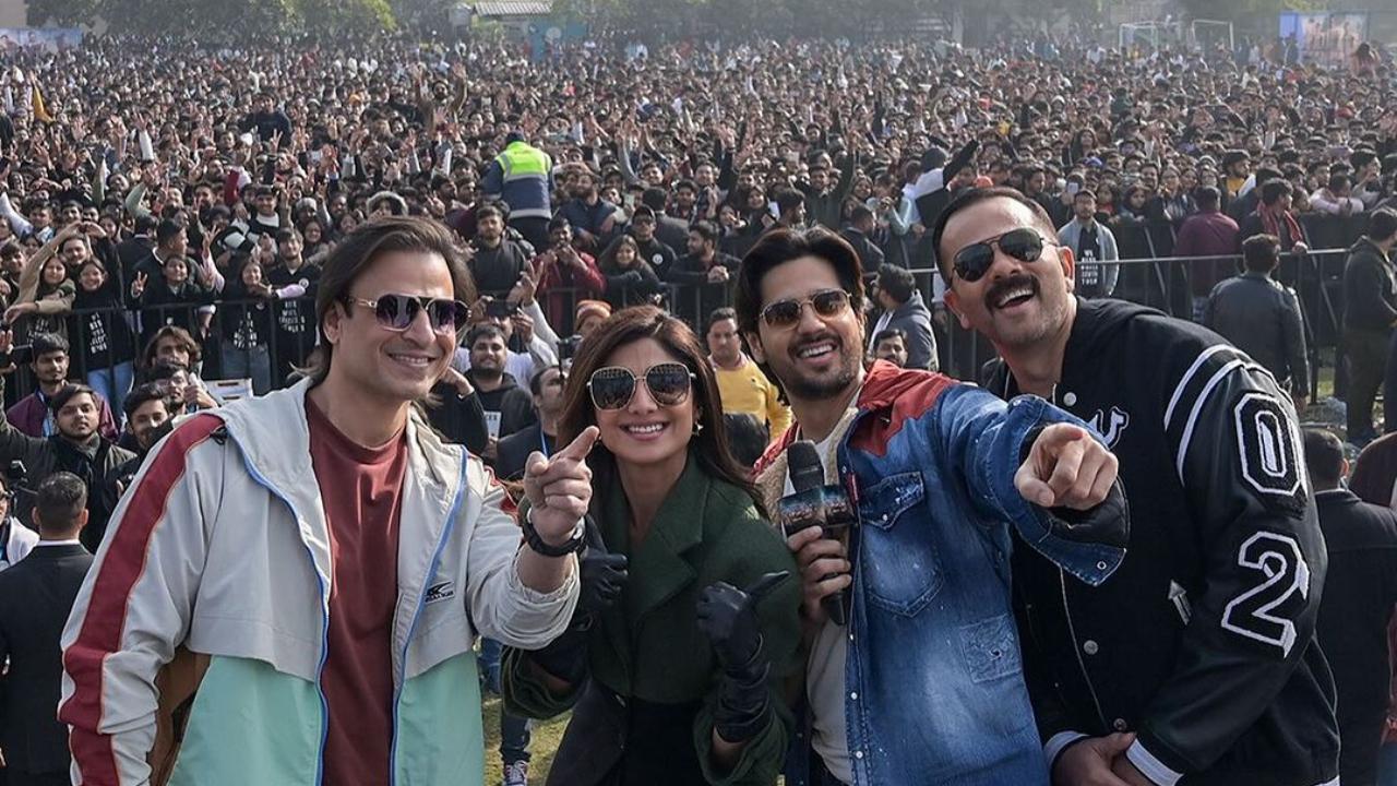 The cast of Rohit Shetty's 'Indian Police Force', which includes Sidharth Malhotra, Shilpa Shetty, and Vivek Oberoi in the lead, pose for a selfie with the crowd in New Delhi