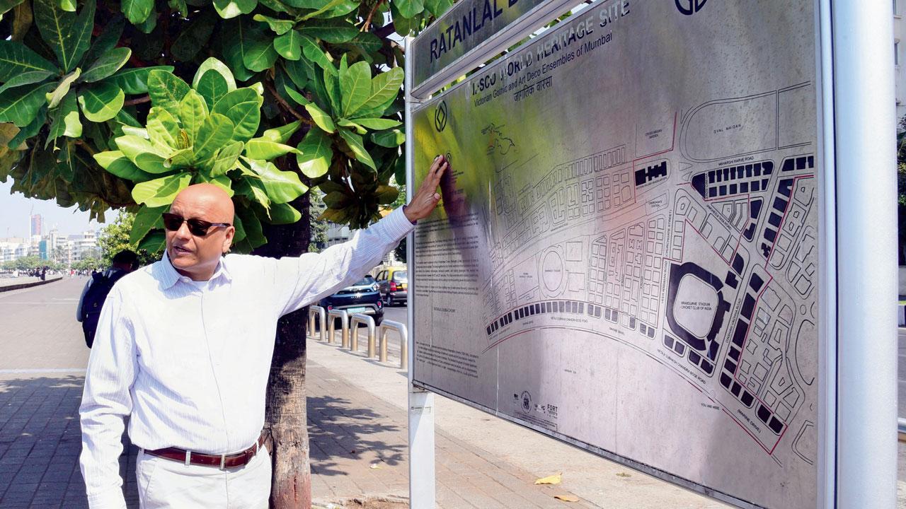 Atul Kumar at the Marine Drive wayfinder map. Pedestrians use it to orient themselves, and identify Art Deco buildings through the floor elevation plaques