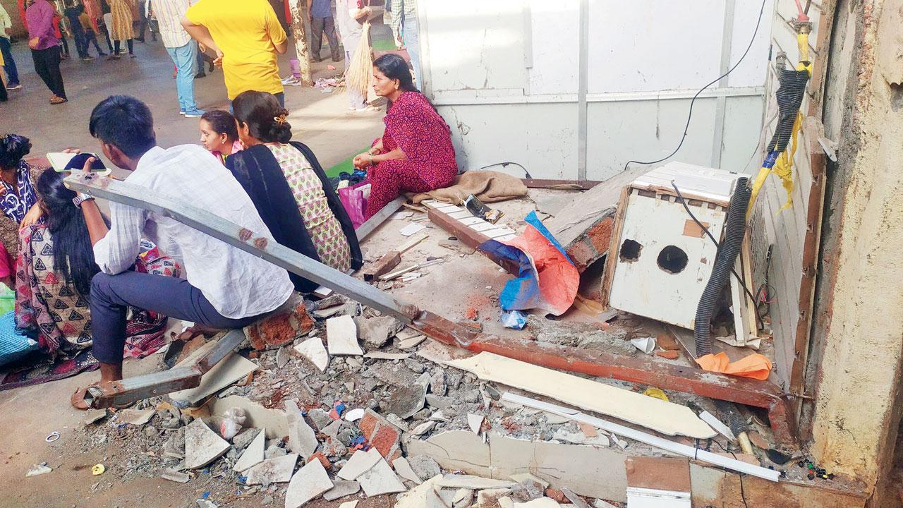 A stall was demolished outside the Siddhivinyak temple. Pic/Anurag Ahire