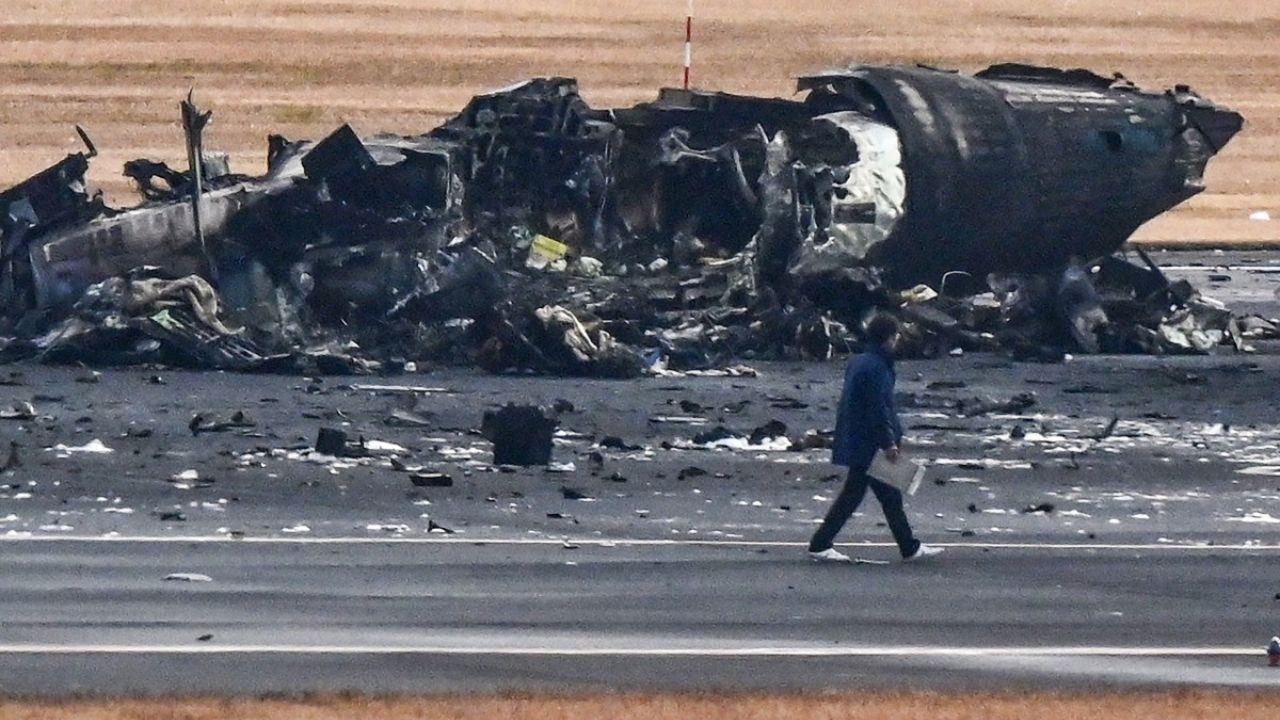 Television footage showed an orange fireball erupting from the Japan Airlines plane as it collided while landing, and the airliner then spewed smoke from its side as it continued down the runway. Within 20 minutes, all passengers and crew members slid down emergency chutes to get away.