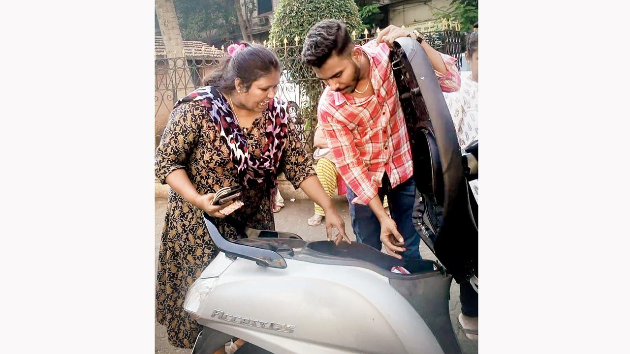 The female gang member overseeing cash stored the boot of a scooter