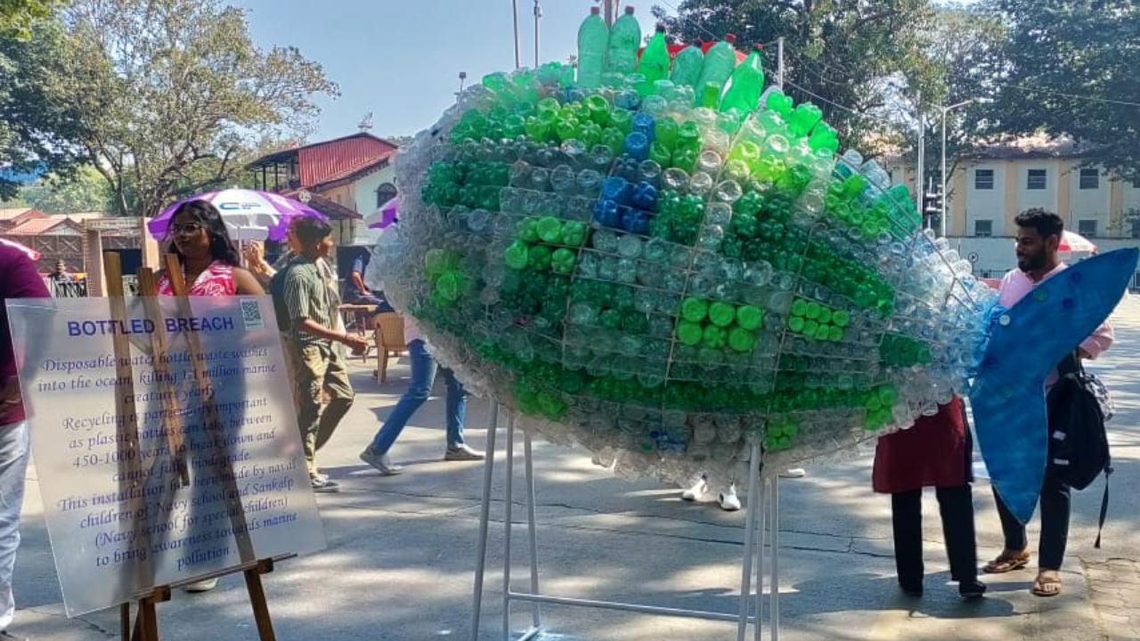 Titled 'Bottled Breach', this artwork by the Naval children of Navy School and Sankalp (Navy school for special children) aims to raise awareness towards marine pollution. With disposable water bottle waste going into the ocean and killing marine life, they remind that recycling is very important as plastic takes 450 - 1,000 years to break down and don't full biodegrade.