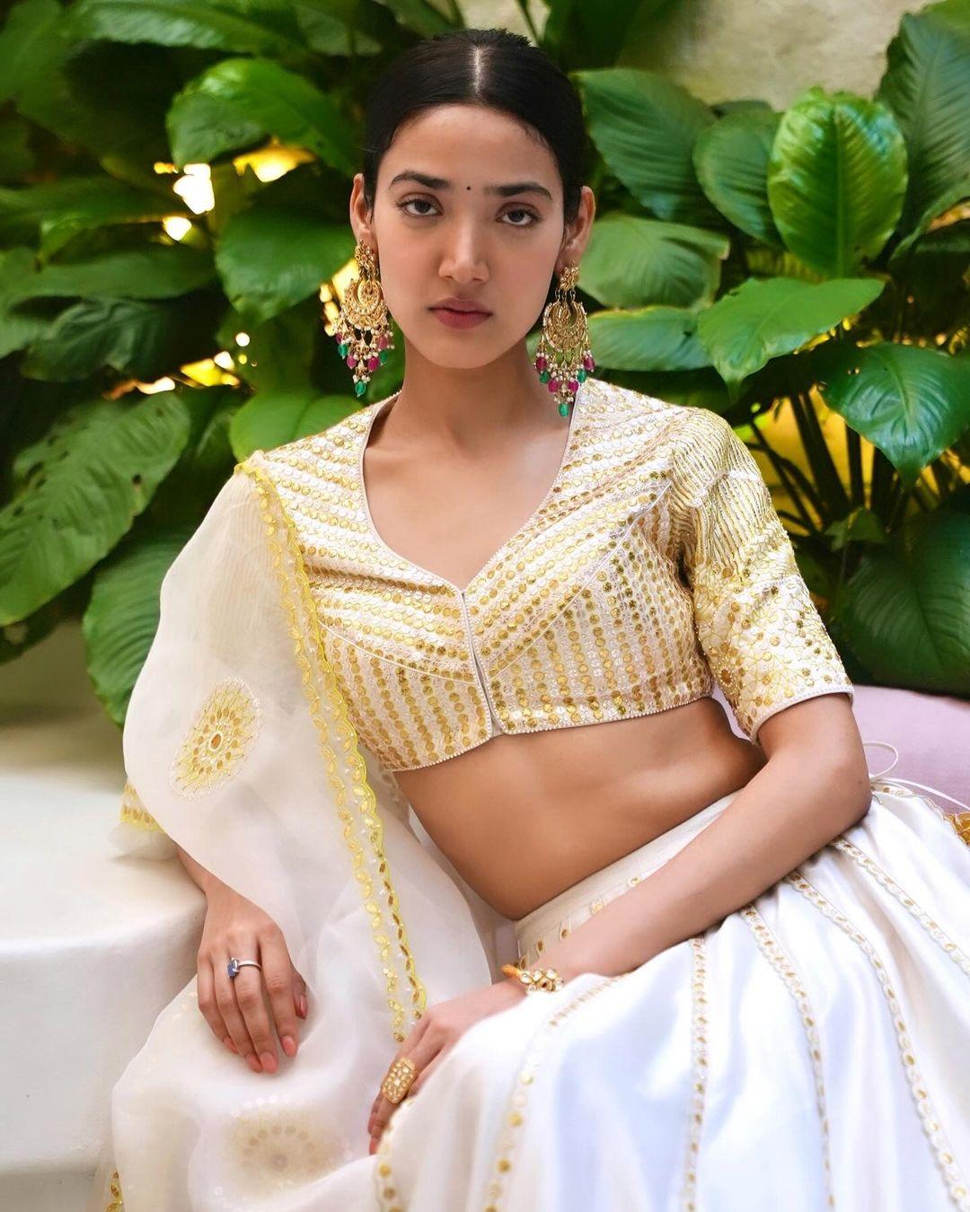 Medha stuns in a beautiful white lehenga adorned with golden prints
