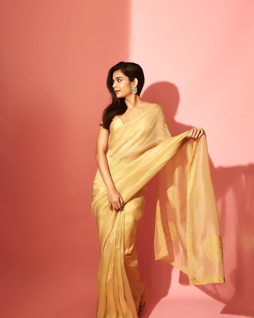Mithila shines in a beautiful yellow saree with intricate designs