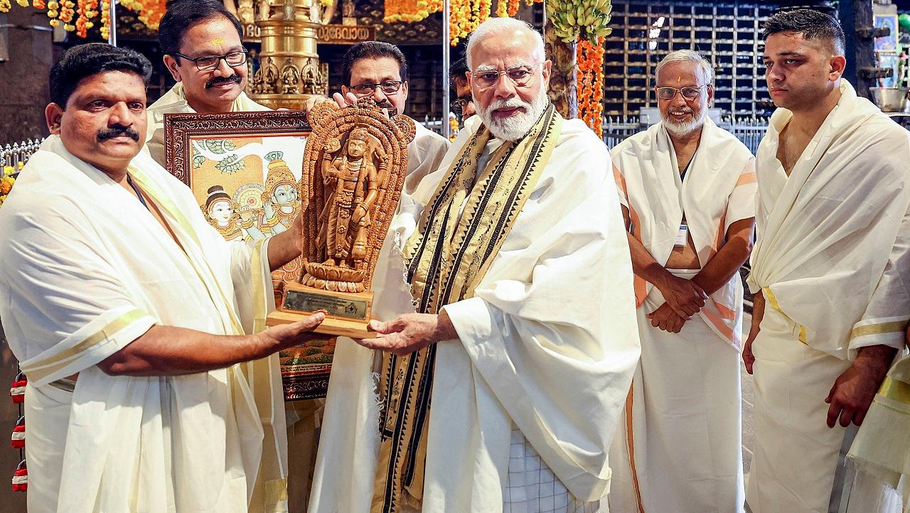 Along the route to the temple, the people gathered on both sides of the road showered his sedately moving vehicle with flowers, waved BJP flags and chanted his name