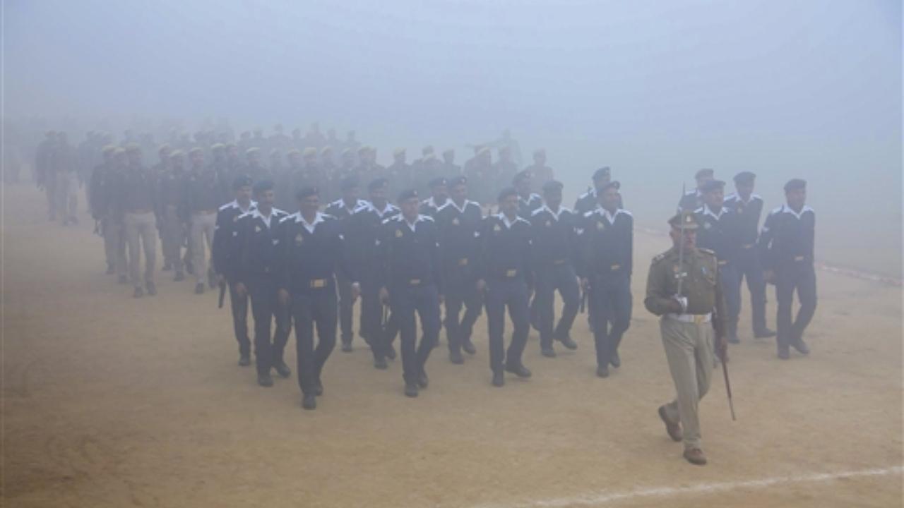 Police personnel during rehearsal for the Republic Day Parade 2024 amid morning fog, in Mathura on Saturday
