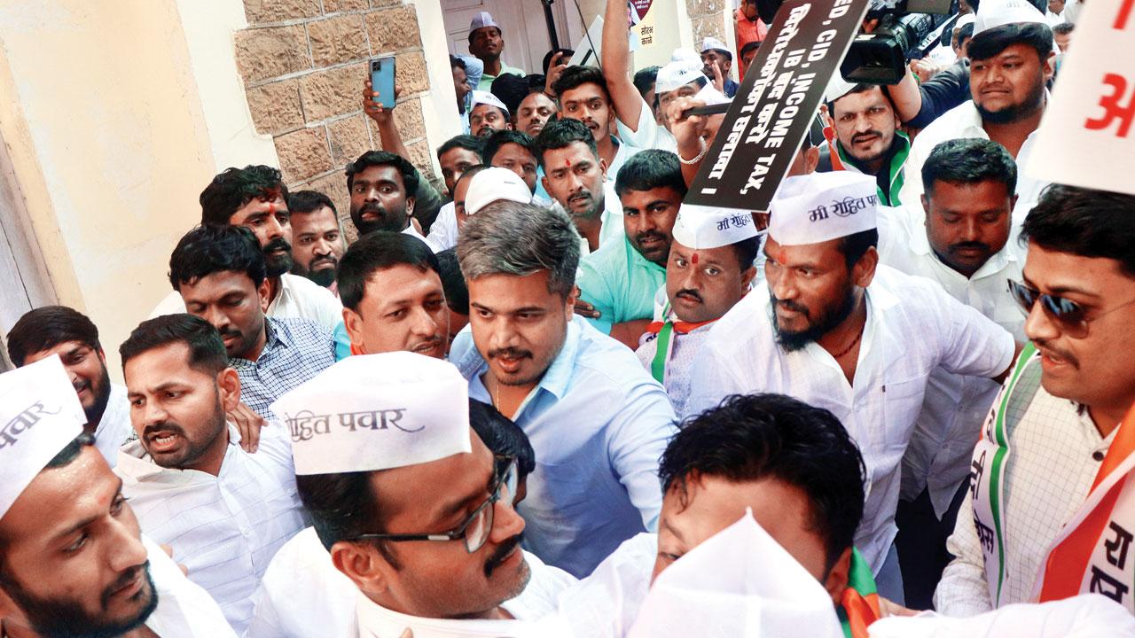 Rohit Pawar at the NCP office surrounded by party workers before going to the ED office. Pic/Anurag Ahire