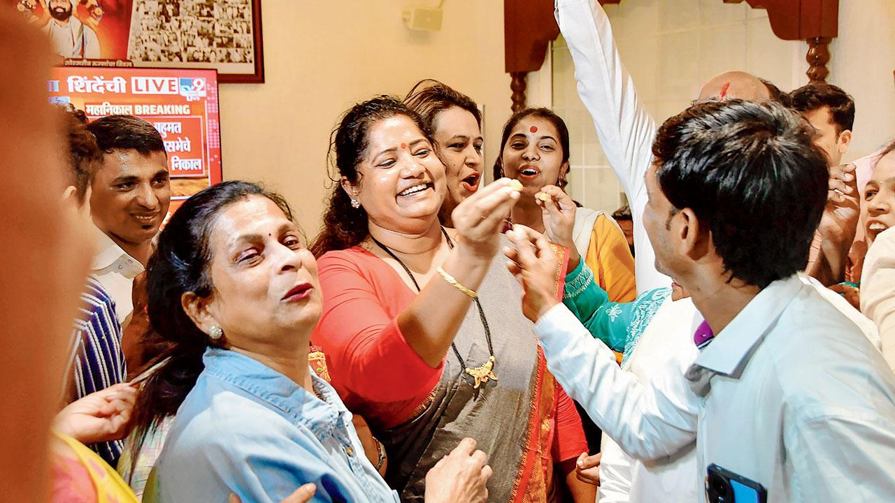 Shiv Sena (Shinde faction) workers celebrate after the verdict in the MLA disqualification case. Pic/PTI