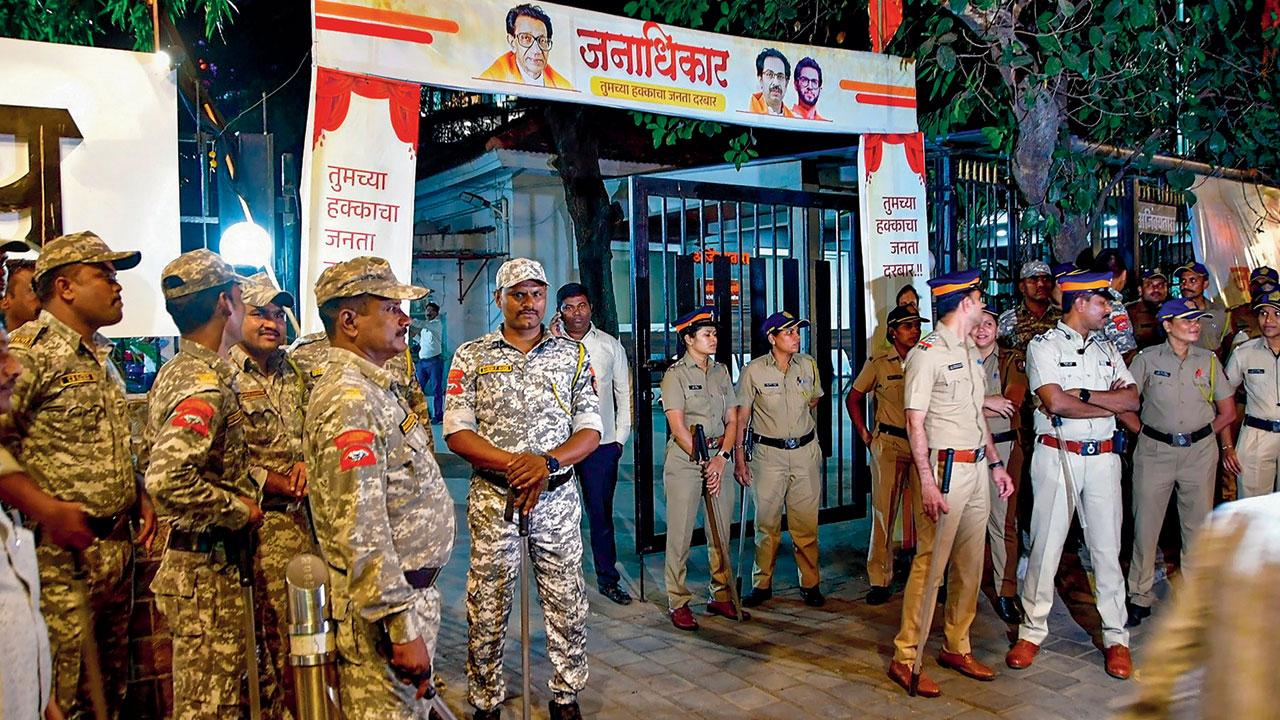 Police personnel stand guard during the celebration in Mumbai. Pic/PTI