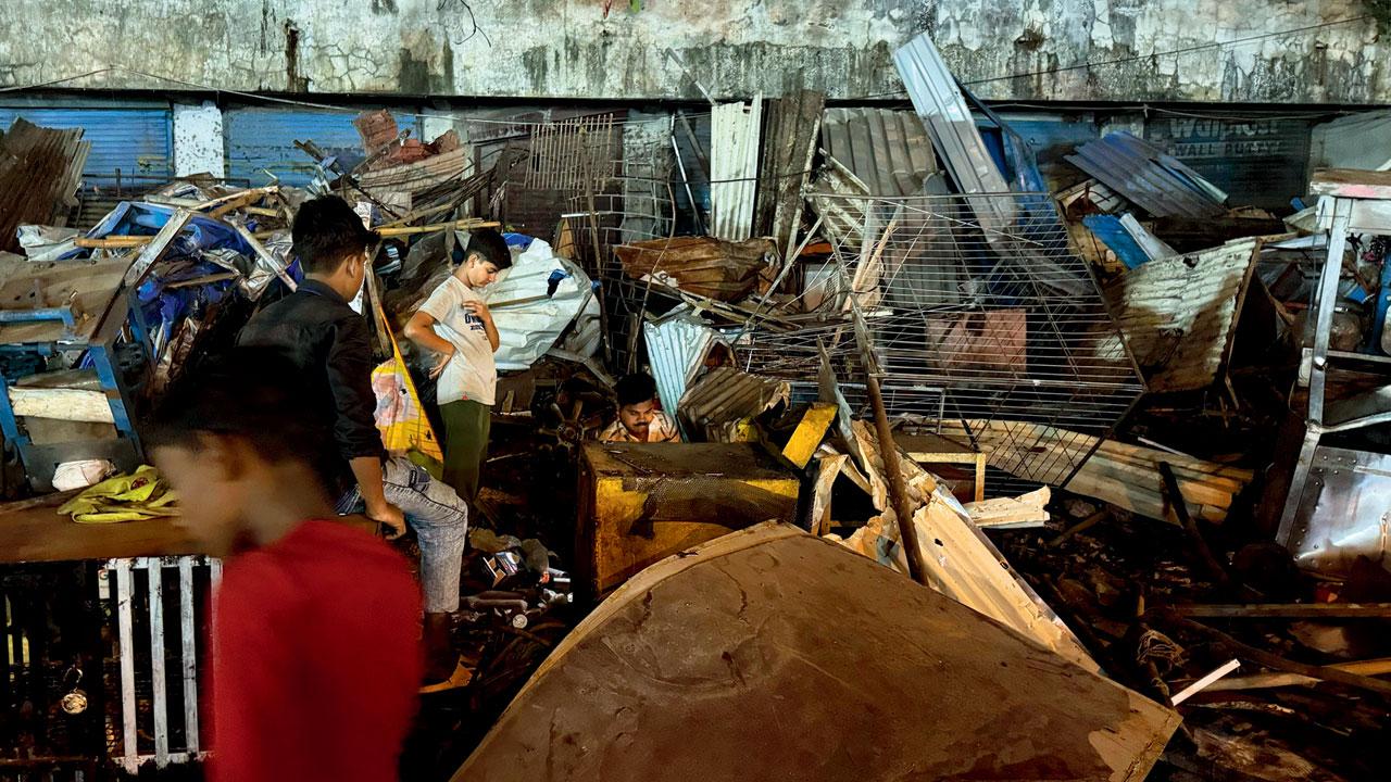 The stall looking through the ruins of the shop after they were demolished. Pic/Hanif Patel