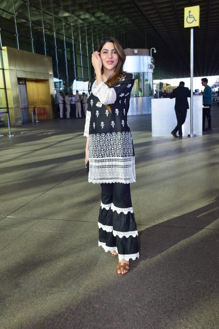 Nikki Tamboli looked stunning as she put on a black chikankari suit for her airport look