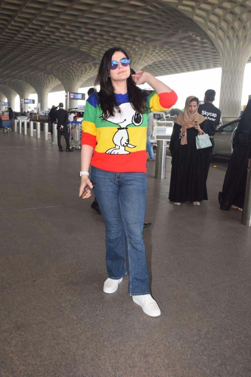 Zareen Khan wore a multi-coloured sweater as she was clicked at the airport