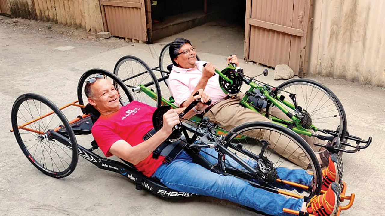 Rajiv Mehta (right) tries out one of Voorman’s (left) special cycles