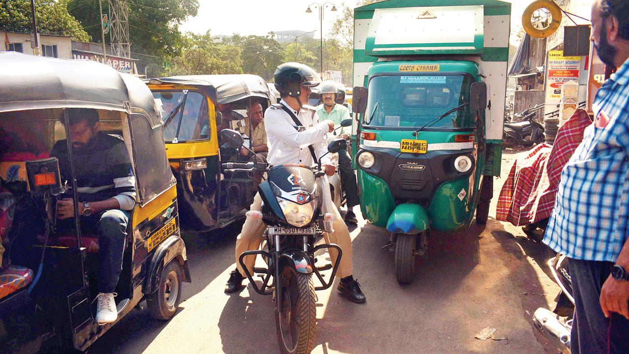 The heavy flow of traffic on the busy road is a hindrance for pedestrians. Pics/Sameer Markande