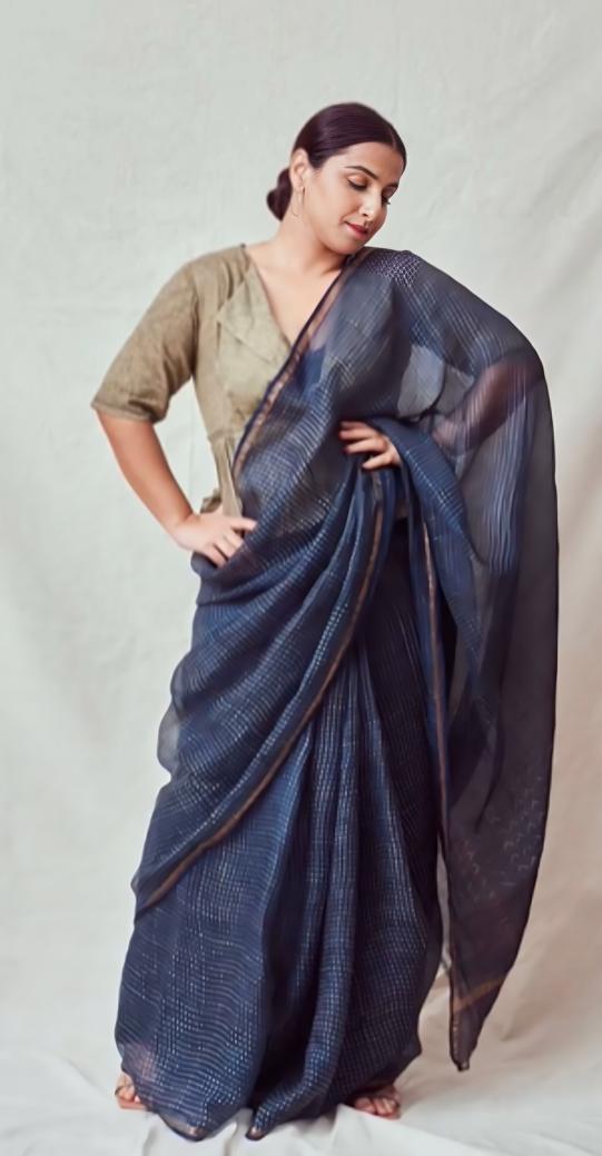 Vidya chose a stylish approach in draping her saree by opting for a vibrant blue colour. She paired it with a stunningly contrasting cream blouse to complete her look