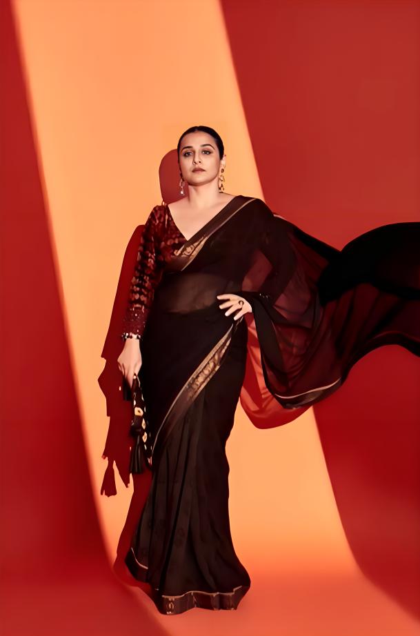This happens to be one of our most favorite looks of the actress. With her hair tied in a chic bun and minimal jewelry, she wore a black tissue saree that is sure to garner lots of praises