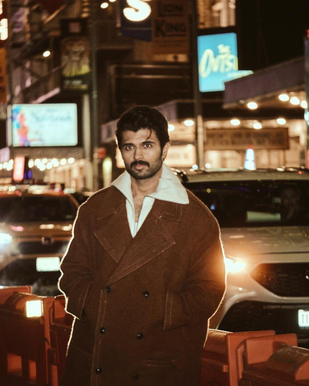 The actor was photographed on a busy street with a smile on his face