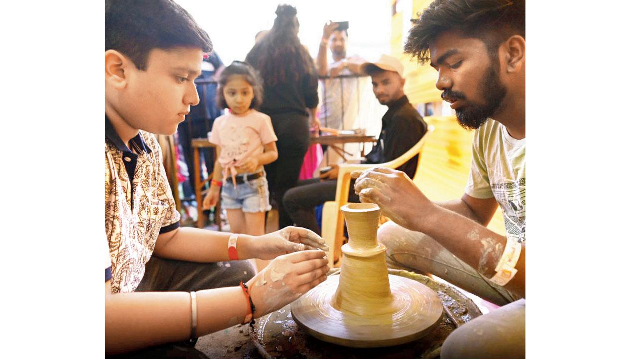 Participants try their hand at pottery at a previous edition