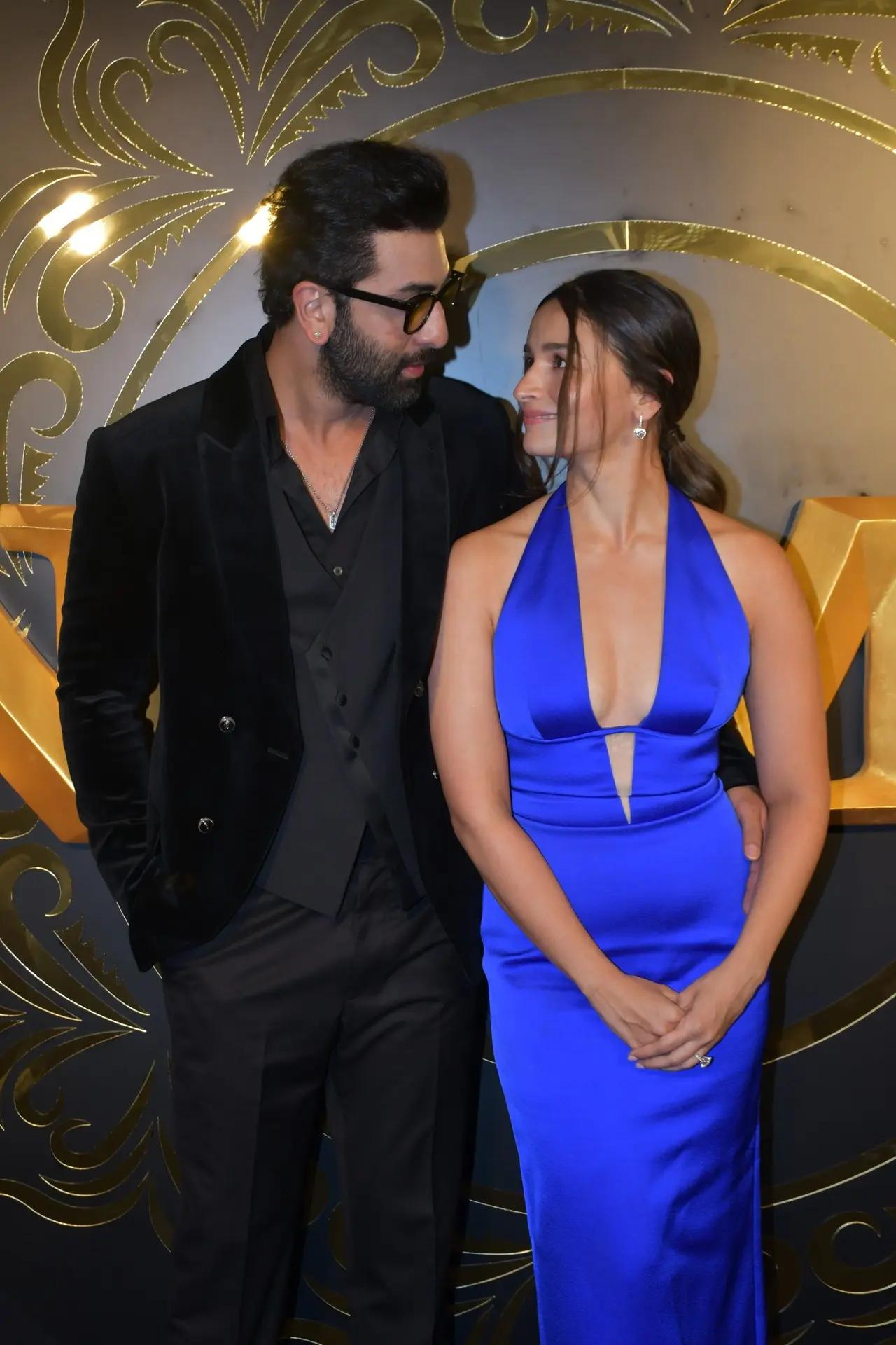 Alia Bhatt and Ranbir Kapoor stunned on the night of Animal success party. Alia Bhatt donned this beautiful blue dress which featured a plunging neckline. While Ranbir Kapoor looked dapper in a suit. (Pic/Yogen Shah)