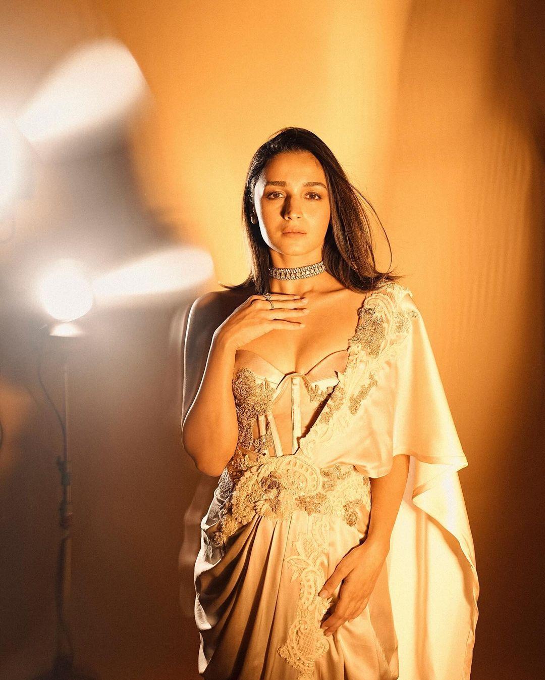 Her white ensemble offered a modern interpretation of the traditional saree, with a blouse that resembled a corset and a saree draped in a contemporary style.