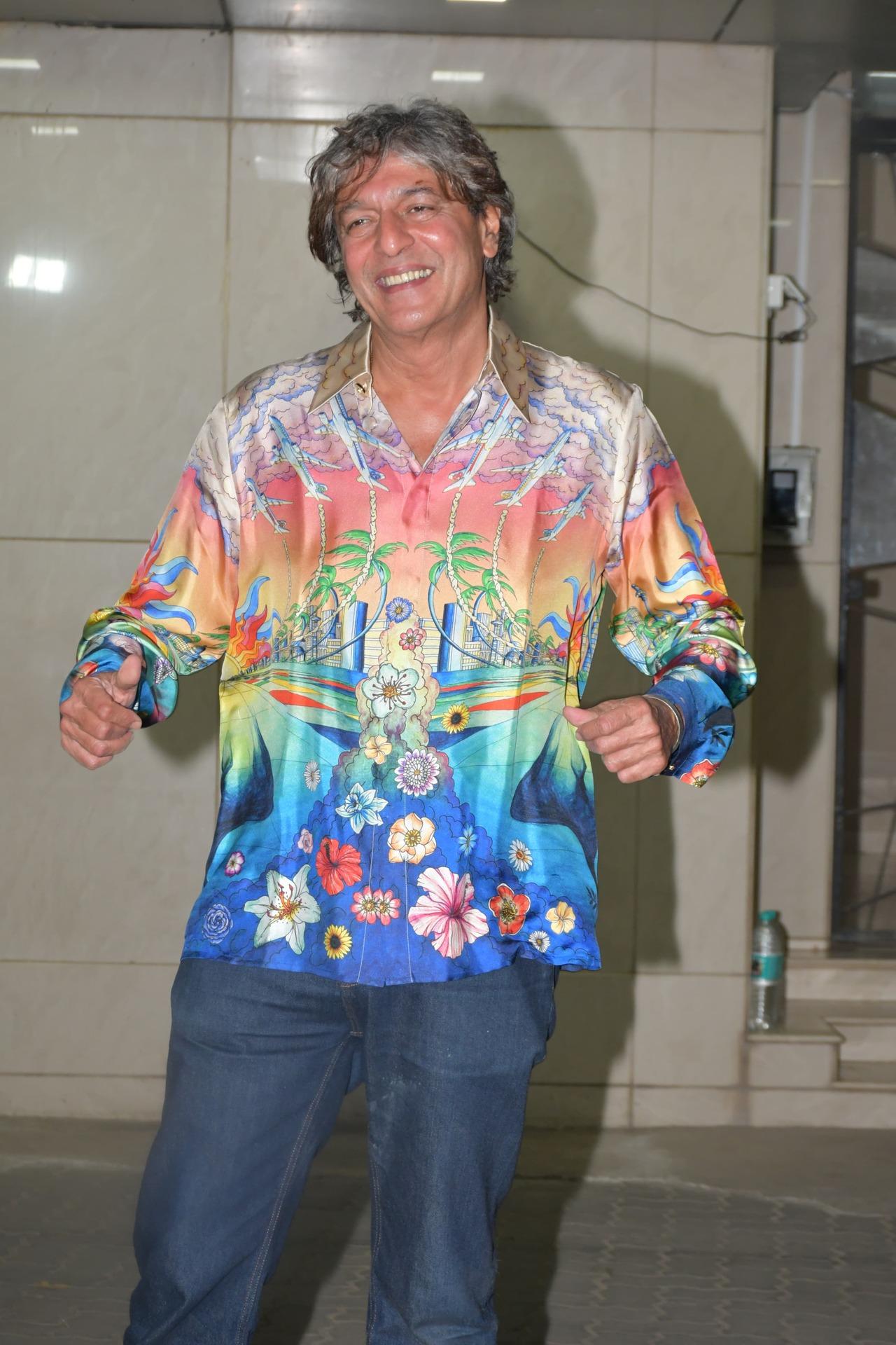 Actor Chunky Panday arrived for the party in a multi-coloured shirt and blue denim pants 