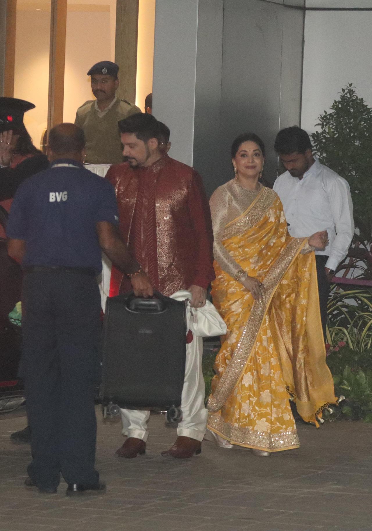 Madhuri Dixit opted for a gorgeous yellow saree for the occasion while Dr Nene looked sharp in a bright red kurta