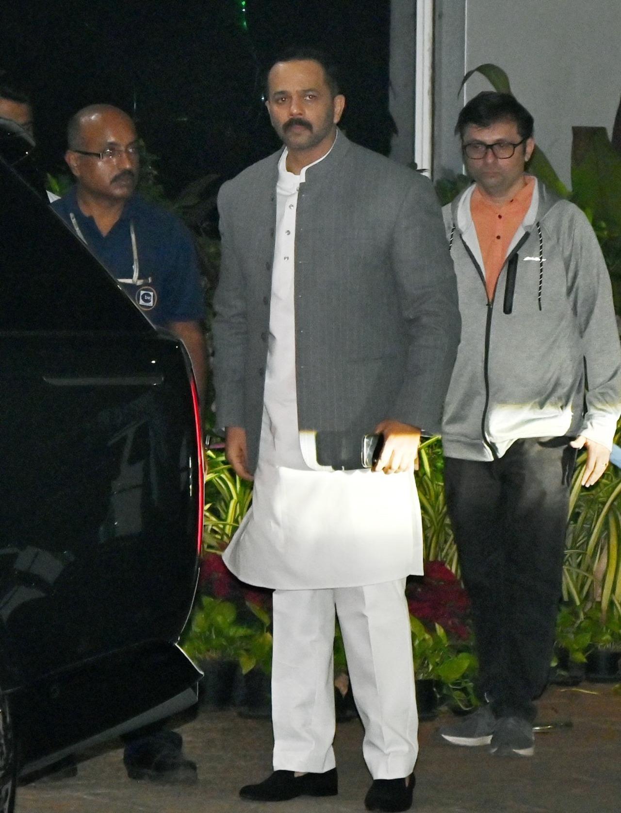Filmmaker Rohit Shetty was seen dressed in a white kurta-pajama and grey coat over it
