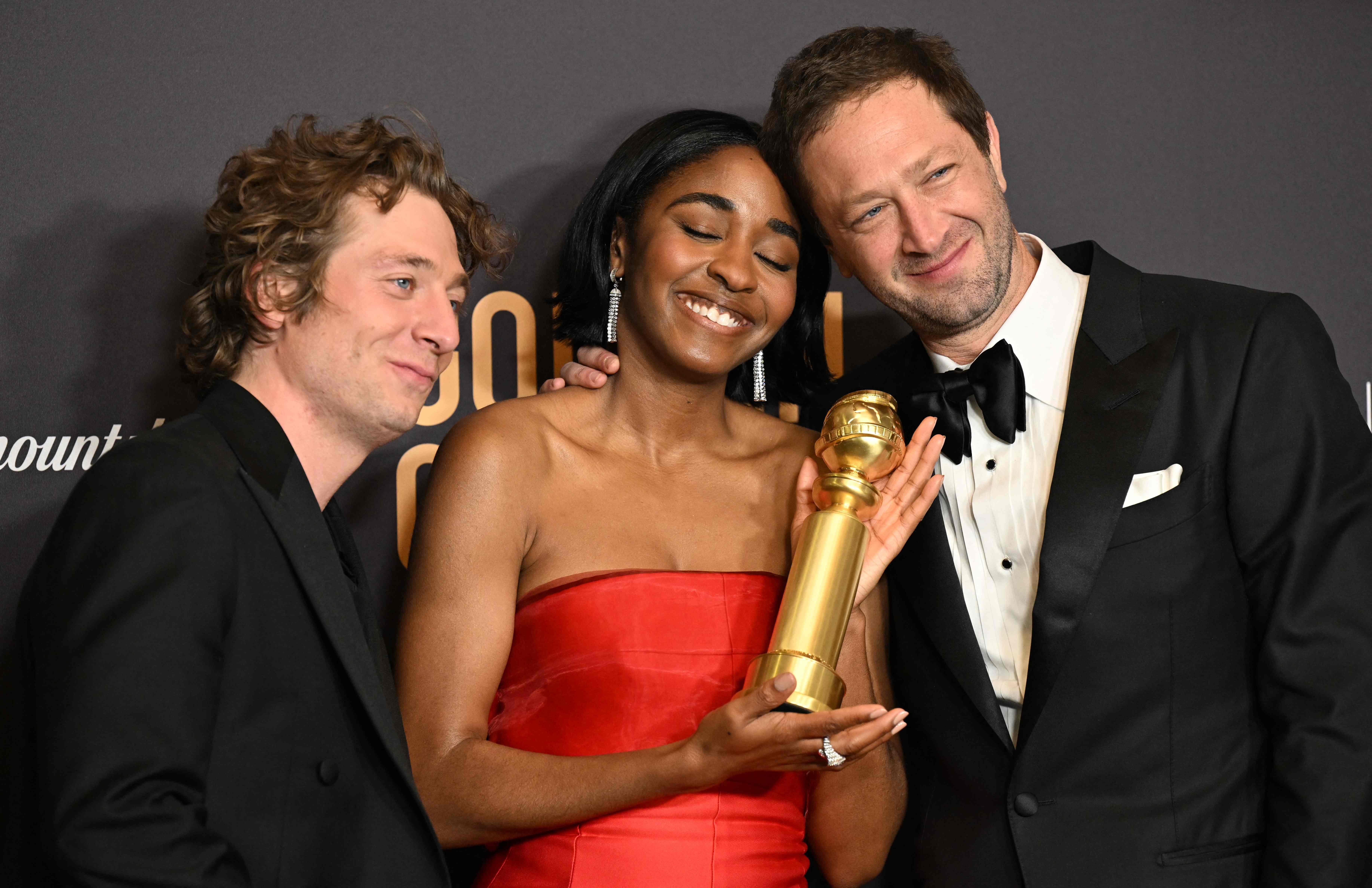 Jeremy Allen White, actress Ayo Edebiri and actor Ebon Moss-Bachrach pose in the press room with the award for Best Television Series - Musical or Comedy 