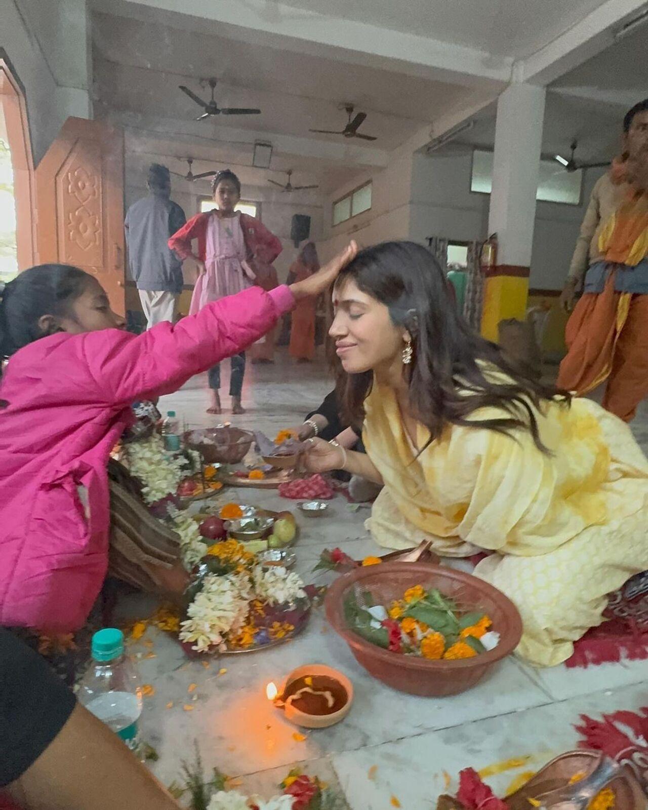 Bhumi Pednekar shared a bunch of pictures from her visit to the Kamakhya Temple in Guwahati, Assam. She is seen getting the red tilak on her forehead by a young girl at the temple