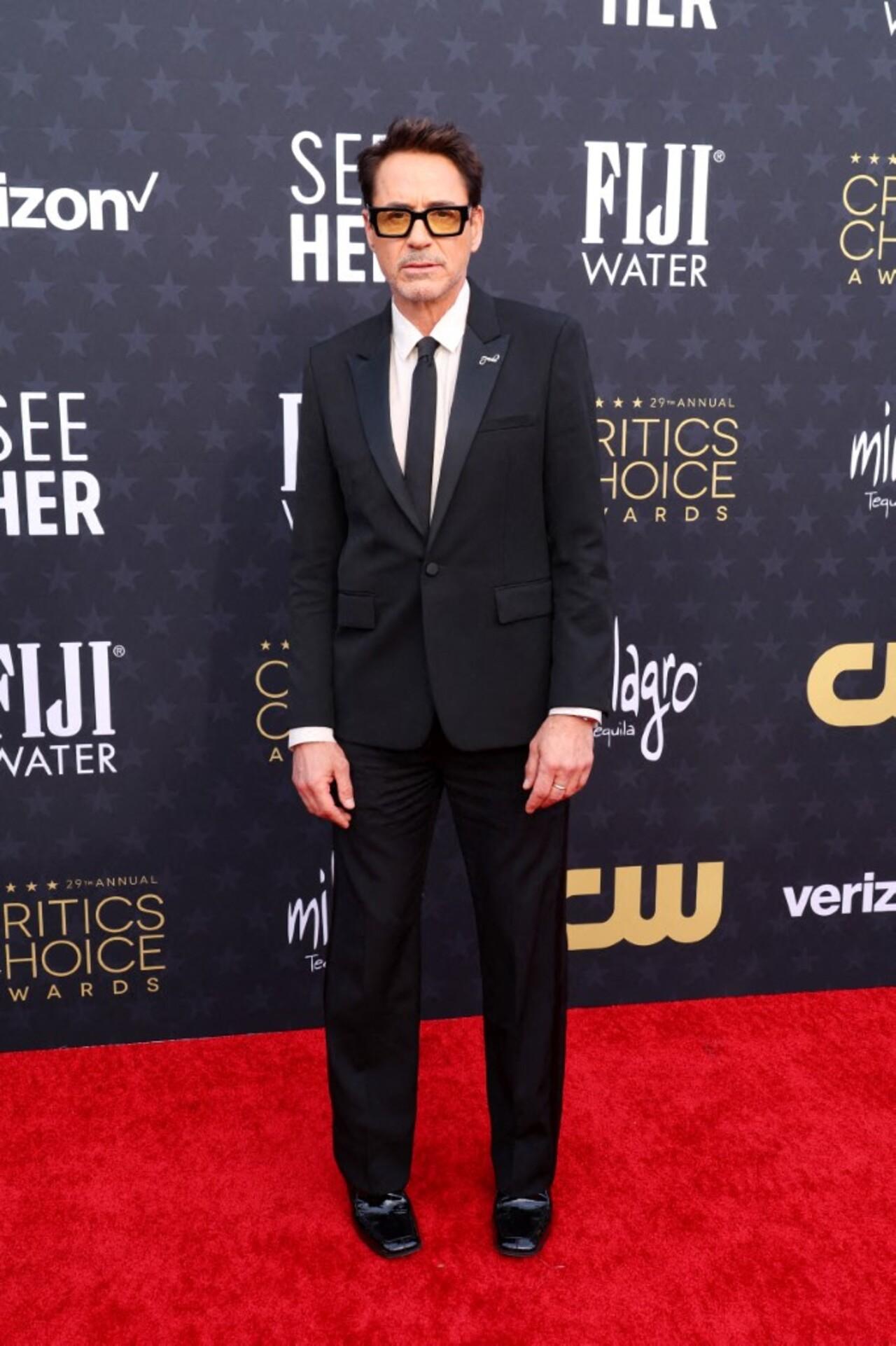 Robert Downey Jr looked sharp in a black suit. He bagged the Best Supporting actor award for Oppenheimer