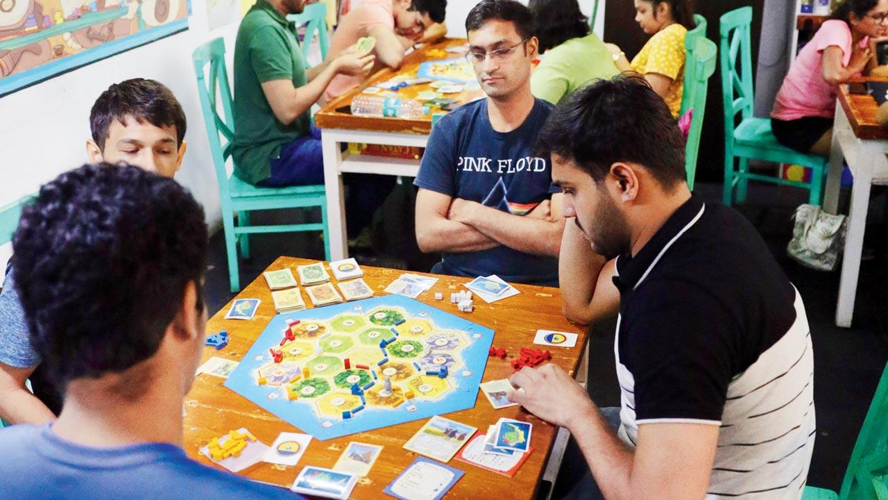 Board games enthusiasts engage in a tournament at the space
