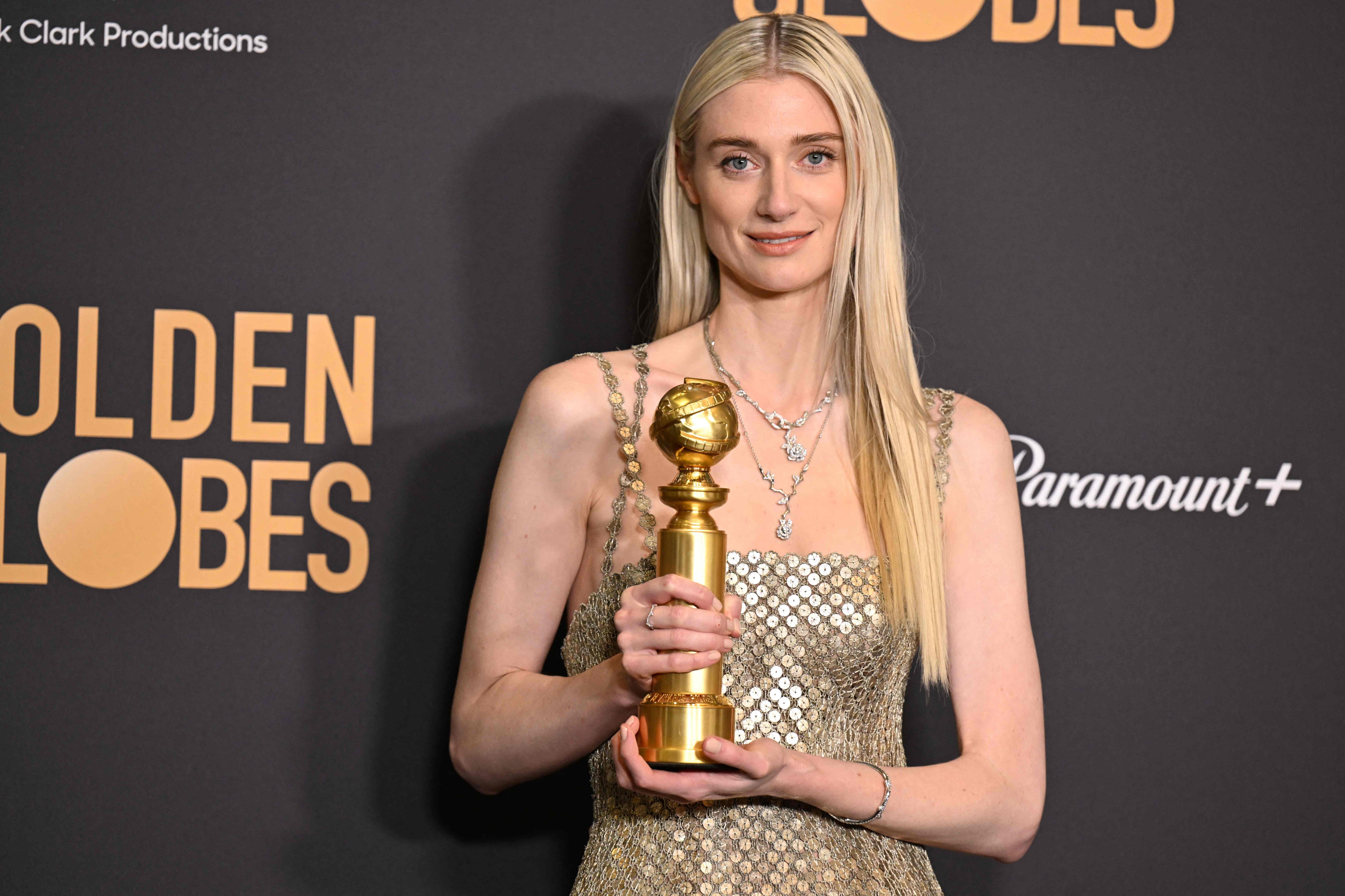 Australian actress Elizabeth Debicki poses with the award for Best Performance by a Female Actor in a Supporting Role on Television for 'The Crown'