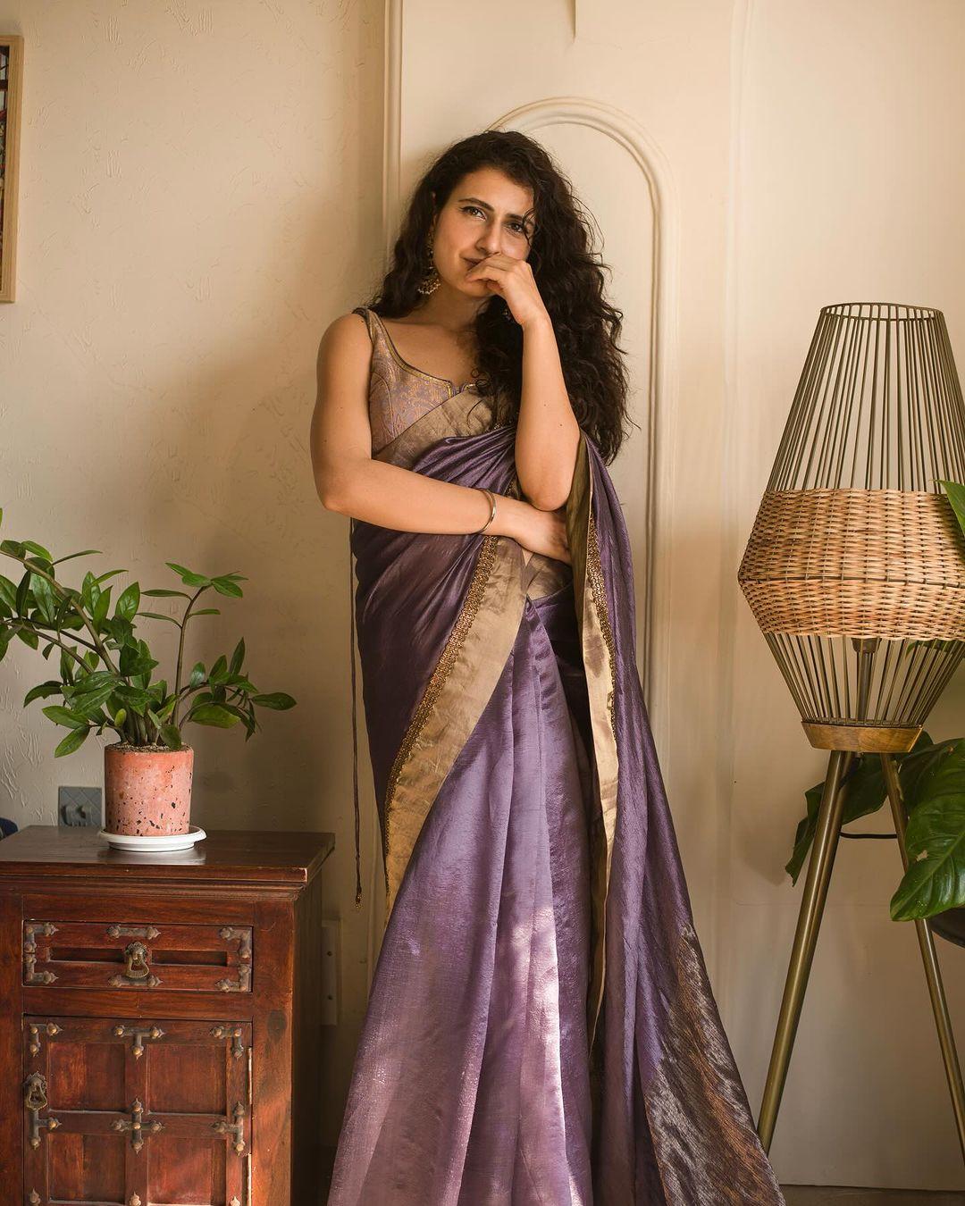 Fatima Sana Shaikh looked gorgeous in a beautifully designed saree that reflects rich cultural traditions. She donned the Radha saree along with the Ruhani blouse in Himroo. The saree and blouse are dyed with Sappan wood to create a stunning violet color. Himroo is an age-old weaving style from Maharashtra that has been revived using recycled cotton. The textile waste is carefully broken down into fibers, which are then converted into new yarn and hand-woven into this traditional textile.