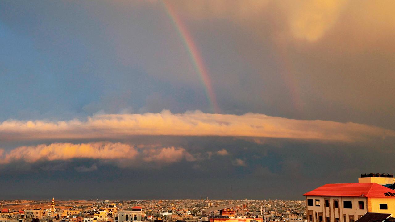 A rainbow seen across the sky amid ongoing battles. Pic/AP