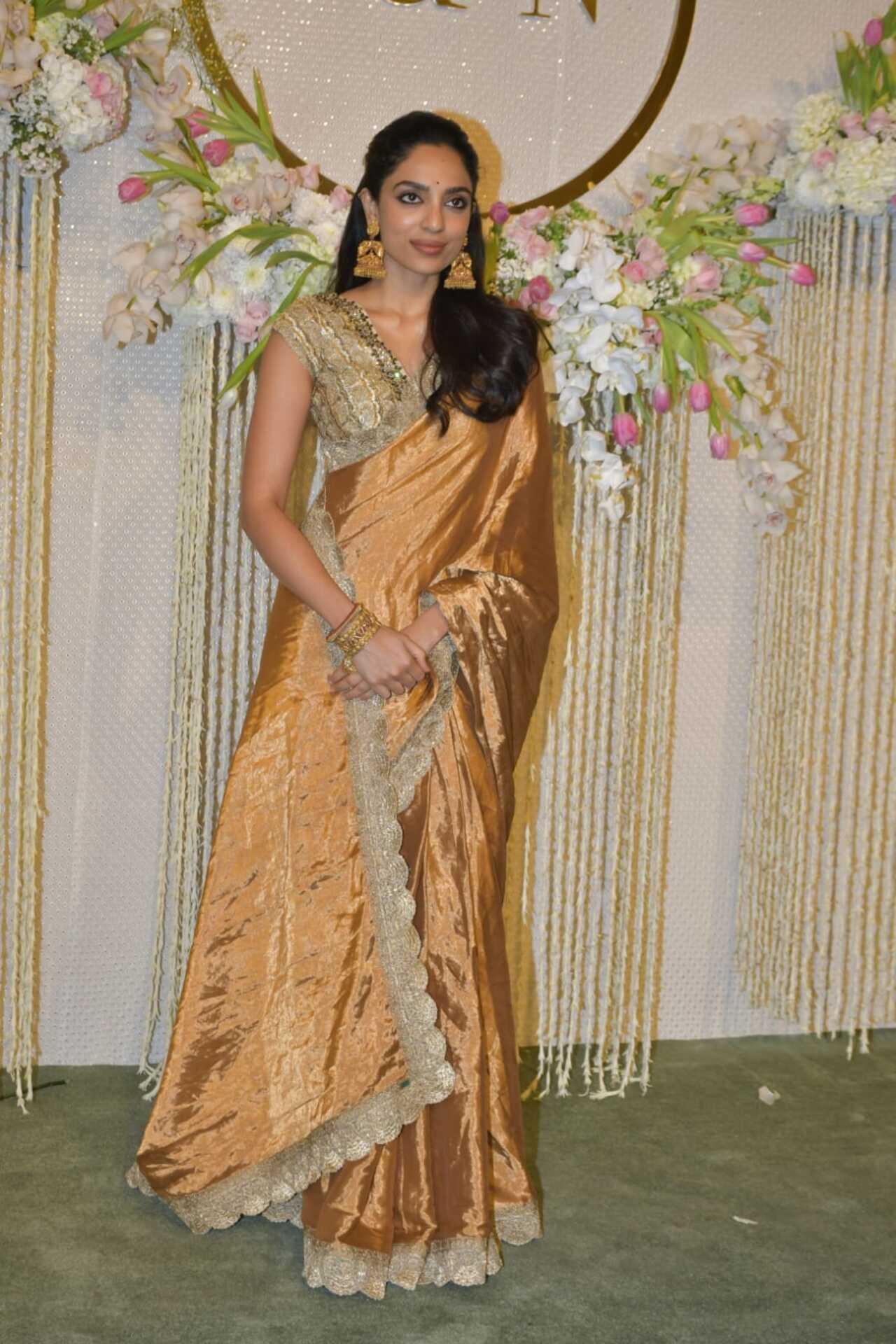 Sobhita Dhulipala opted for a golden tissue saree. She tied her hair in a semi-pony and let her statement jhumkas give the complete desi look to her outfit