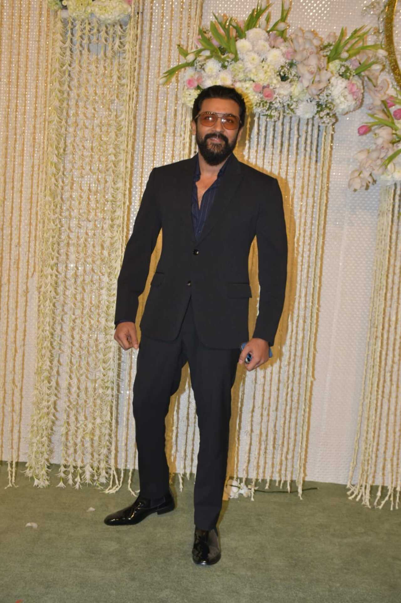 Actor Suriya looked dapper in an all-black suit and brown shades